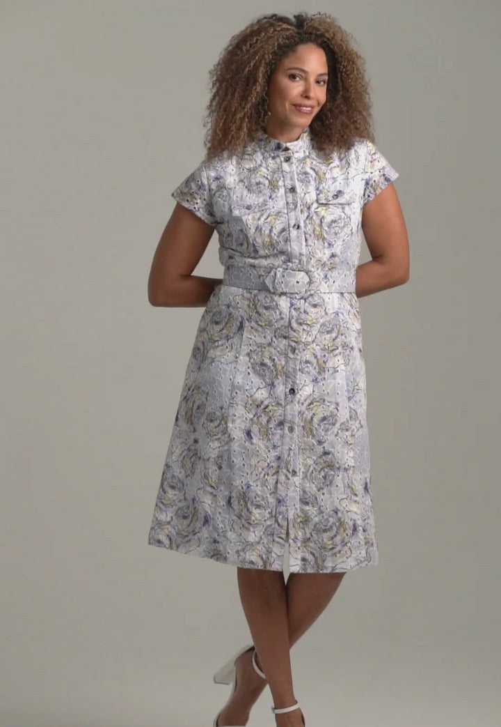 Woman wearing blue rose printed cotton eyelet short dress with belt by Ala von Auersperg for spring summer 2022