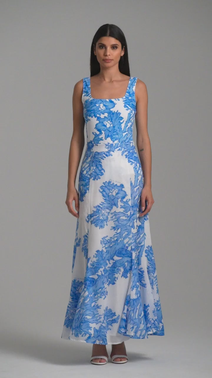 Woman wearing blue coral printed cotton voile long skirt with blue coral printed square neck stretch knit tank top by Ala von Auersperg for resort 2023