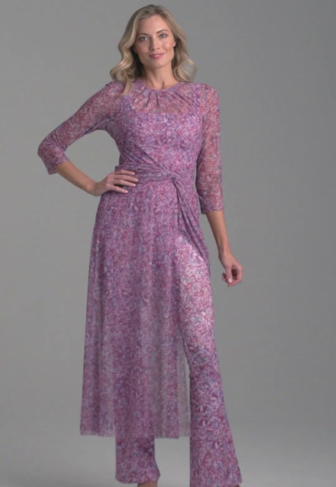 Woman wearing mesh topper in printed pink orchid flowers over stretch knit printed pink orchid flowers over tank top and pants for resort 2022