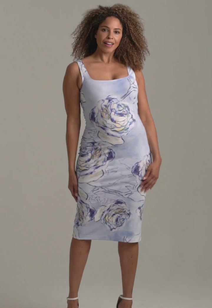 Woman wearing blue rose printed short square neck stretch knit dress by Ala von Auersperg for spring summer 2022